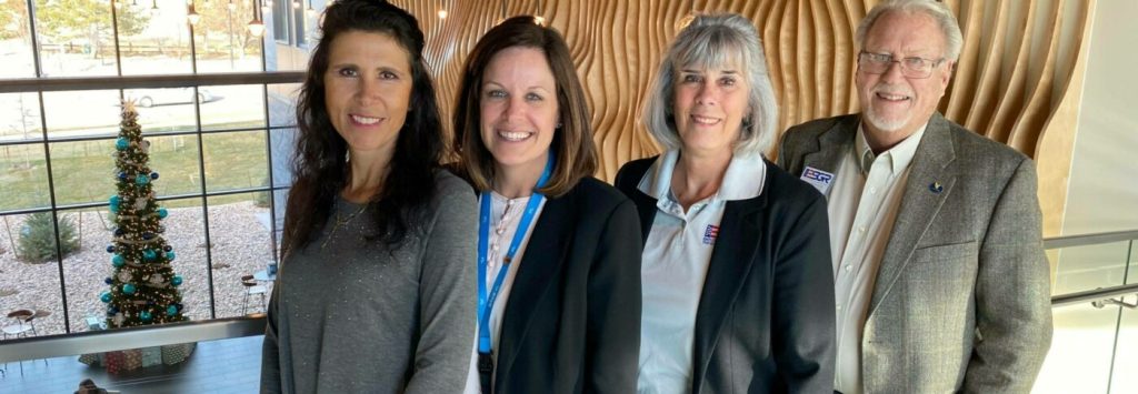 Blue FCU leadership standing with ESGR leadership.