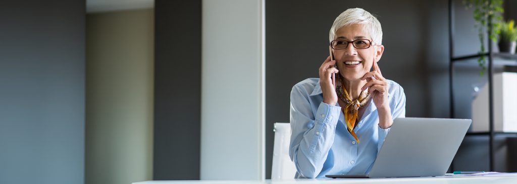 A women on a phone in an office space