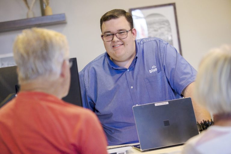 Blue staff serving people
